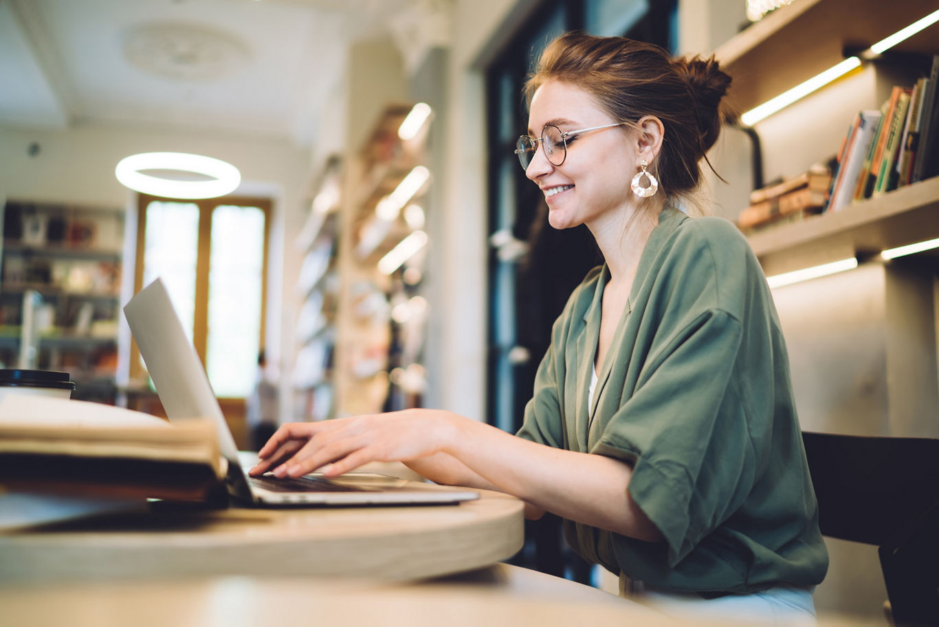 Woman Doing Work in Coffee Shop | Blog | Greystar